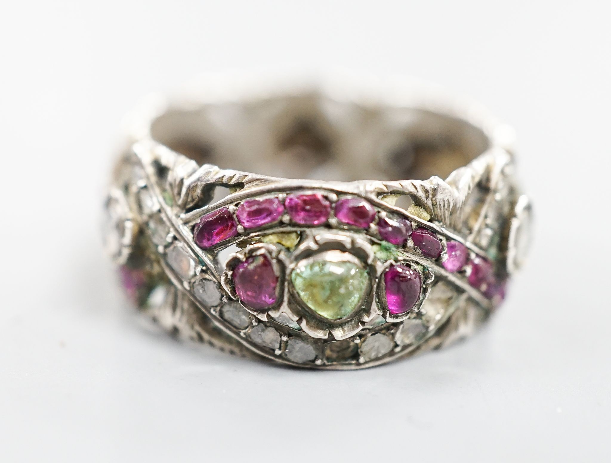 A 19th century Austro-Hungarian pierced white metal, diamond and gem set band, size W/X.